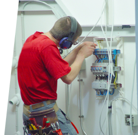 MC Electrical electrician wiring a distribution board